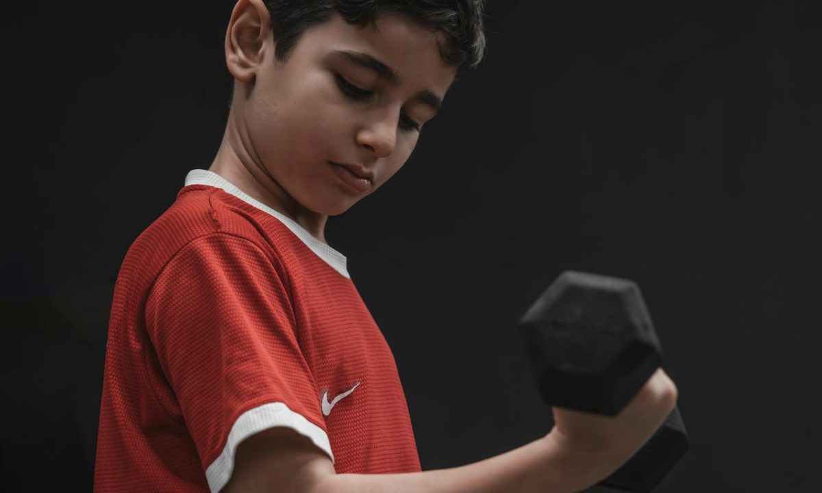 small kid bicep curl lifting weight