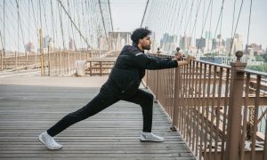 man stretching exercising outside