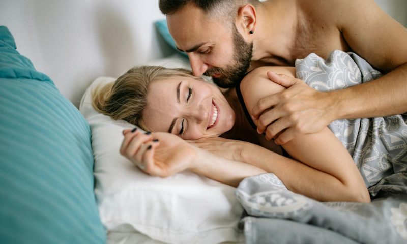 man and woman smiling